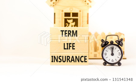 Term life insurance symbol. Concept words Term life insurance on beautiful wooden blocks. Beautiful white background. Black alarm clock. Business term life insurance concept. Copy space. 131541348