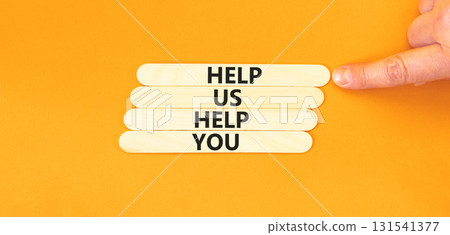 Help you symbol. Concept words phrase Help us help you on beautiful wooden stick. Businessman's hand. Beautiful orange paper background. Business Help you concept. Copy space. Help you symbol. Concept words phrase Help us help you on beautiful wooden stick. Businessman's hand. Beautiful orange paper background. Business Help you concept. Copy space. 131541377