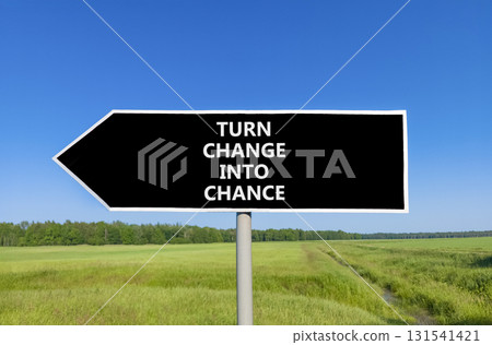 Turn change into chance symbol. Concept words phrase Turn change into chance on beautiful road sign. Beautiful blue sky green grass background. Business Turn change into chance concept. Copy space 131541421