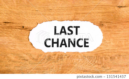 Last chance symbol. Concept word Last chance on beautiful white paper. Beautiful wooden paper background. Business last chance concept. Copy space. Last chance symbol. Concept word Last chance on beautiful white paper. Beautiful wooden paper background. Business last chance concept. Copy space. 131541437
