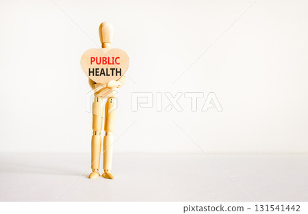 Public health symbol. Concept words Public health on beautiful wooden heart. Doctor's model. Beautiful white background. Copy space. Medical healthy lifestyle public health concept. Public health symbol. Concept words Public health on beautiful wooden heart. Doctor's model. Beautiful white background. Copy space. Medical healthy lifestyle public health concept. 131541442