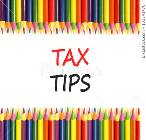 Tax tips symbol. Concept word Tax tips on beautiful white paper. Colored pencils. Beautiful white paper background. Business tax tips concept. Copy space. Tax tips symbol. Concept word Tax tips on beautiful white paper. Colored pencils. Beautiful white paper background. Business tax tips concept. Copy space. 131541476