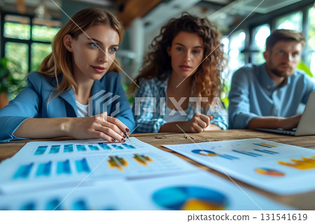 Team discussing investment plan with bar and pie charts, modern style Team discussing investment plan with bar and pie charts, modern style 131541619