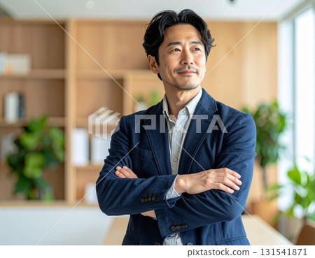Business portrait of a middle-aged man standing confidently in a startup-style office 131541871
