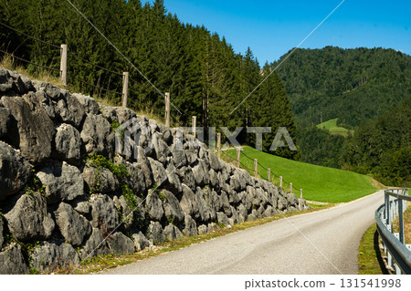 Serene Mountain Landscape with Road and Nature Serene Mountain Landscape with Road and Nature 131541998