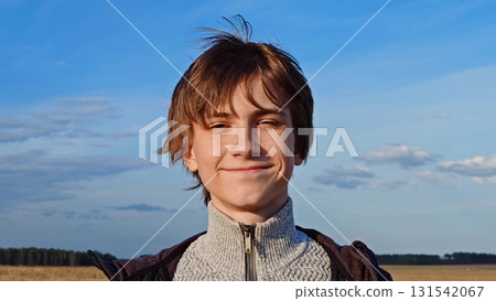 Portrait of smiling teenager boy looking at camera. Lifestyle emotions concept. portrait of a happy teenager in nature. handsome guy, cheerful. 131542067