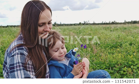 Happy family. mom and son in nature. Mom, child play together in park. Family walk in outdoors. Parents, daughter having carefree fun in nature, they enjoy nature. Happy family. mom and son in nature. Mom, child play together in park. Family walk in outdoors. Parents, daughter having carefree fun in nature, they enjoy nature. 131542071