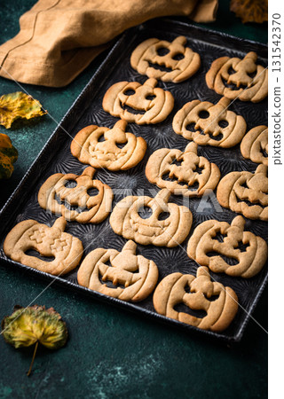 Halloween cookies in shape of jack-o-lantern 131542370