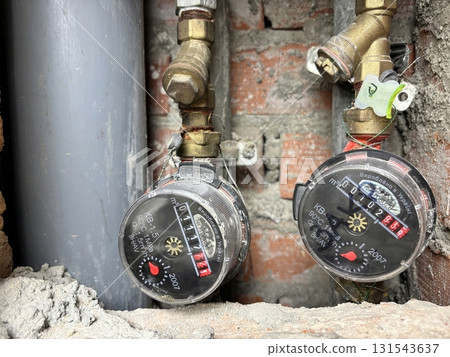 Water meter in a shaft of an apartment building. Utility counter for measuring water consumption 131543637