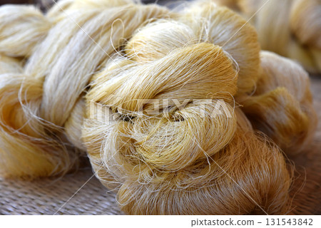 Close up image of tie a yarn of silk. Raw materials prepared for dyeing and weaving into beautiful silk. 131543842