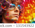 Portrait of man in glasses with rainbow makeup with sequins on colorful blurred background. LGBT Pride concept Portrait of man in glasses with rainbow makeup with sequins on colorful blurred background. LGBT Pride concept 131543922