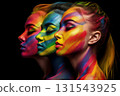 Side view profile portrait of three girls with rainbow make-up for Pride on black background. Rainbow LGBT make-up Side view profile portrait of three girls with rainbow make-up for Pride on black background. Rainbow LGBT make-up 131543925