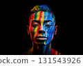 Close up full face portrait of man with rainbow make-up for Pride on black background. Rainbow LGBT make-up Close up full face portrait of man with rainbow make-up for Pride on black background. Rainbow LGBT make-up 131543926