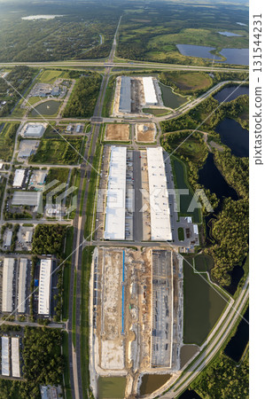 Industrial warehouse construction site. Assembling of metal and concrete frame of new logistics center in North Port, Florida 131544231