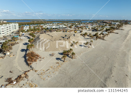 Hurricane aftermath cleanup. Piles of sand at sand recipient site on ocean shore in Florida Hurricane aftermath cleanup. Piles of sand at sand recipient site on ocean shore in Florida 131544245