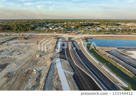 Highway construction in North Port, Florida. Development of American road with moving traffic cars. City transportation improvement 131544412