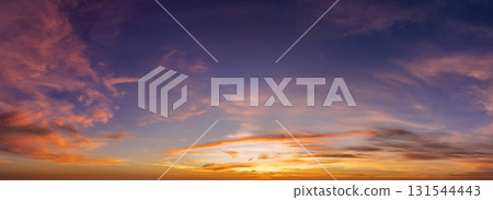Getting dark at sundown. Sunset sky with scattered clouds of bright colors 131544443