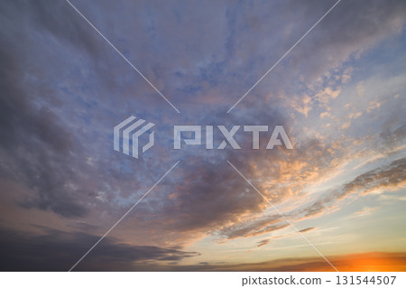 Dramatic sunset sky with orange clouds. 131544507