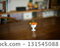 Marigolds in a small antique ceramic vessel 131545088
