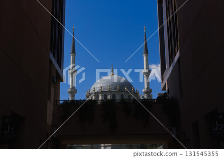 Nursetiye Mosque 1823 framed by Galataport walls in Karakoy Istanbul 131545355