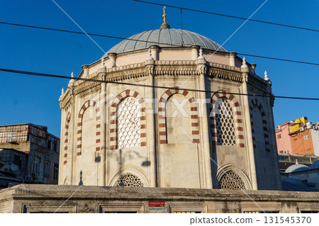 Sinan Pasa Medrese in Istanbul - Ottoman Architecture with Dome and Arched Windows Against Blue Sky Sinan Pasa Medrese in Istanbul - Ottoman Architecture with Dome and Arched Windows Against Blue Sky 131545370