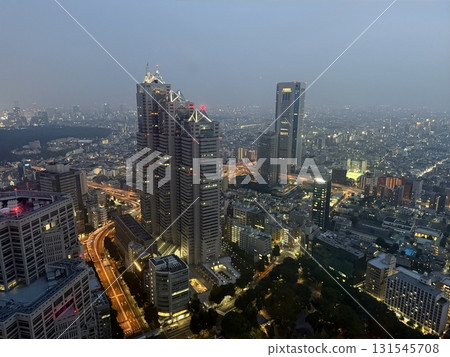 Night view from the Tokyo Metropolitan Government Building, Tokyo skyline at night, cloudy day Night view from the Tokyo Metropolitan Government Building, Tokyo skyline at night, cloudy day 131545708