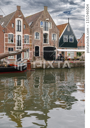 Charming view of Monnickendam, a traditional Dutch village with canals, historic houses, and serene atmosphere. 131546004