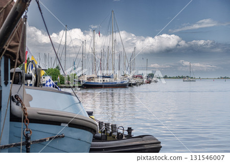 Charming view of Monnickendam, a traditional Dutch village with canals, historic houses, and serene atmosphere. 131546007