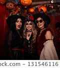 Friends enjoying a Halloween party 131546116