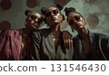 Three young black businesswomen with sunglasses and jewelry are posing together with arms around each other's shoulders, creating a sense of unity and confidence 131546430