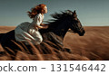 Redhead woman wearing historical dress riding bareback a black horse galloping through a field of wheat creating motion blur in golden hour light 131546442