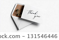 White thank you card with elegant calligraphy emerging from a white and brown envelope with a dried flower inside, expressing gratitude and appreciation on a clean white background 131546446