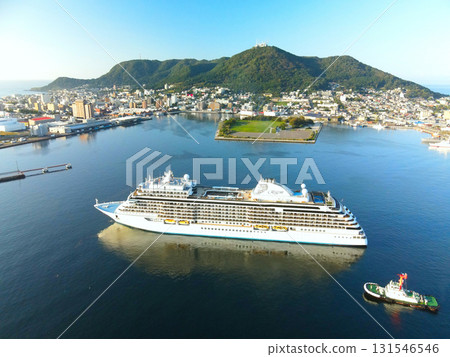 Aerial view of the cruise ship Seven Seas Explorer calling at Hakodate Port in Hakodate, Hokkaido in autumn Aerial view of the cruise ship Seven Seas Explorer calling at Hakodate Port in Hakodate, Hokkaido in autumn 131546546