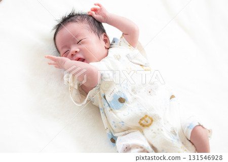 Newborn baby taking a nap 131546928