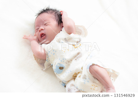 Newborn baby taking a nap 131546929