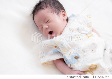 Newborn baby taking a nap 131546936