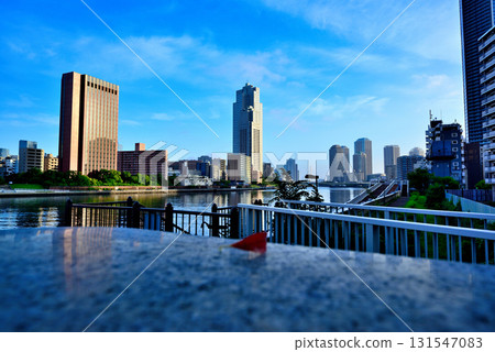 Tokyo: Sumida River and St. Luke's Garden under the early morning blue sky 131547083