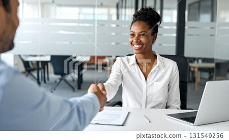Smiling business people shaking hands Smiling business people shaking hands 131549256