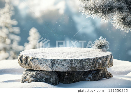 Snowy Stone Surface with Pine Branches in Winter Light 131550255