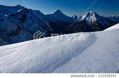 The Yatsugatake Mountain Range and the Southern Alps as seen from Akaiwanoto in the harsh winter The Yatsugatake Mountain Range and the Southern Alps as seen from Akaiwanoto in the harsh winter 131550343