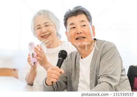 Elderly people singing karaoke in group homes and nursing homes Elderly people singing karaoke in group homes and nursing homes 131550537