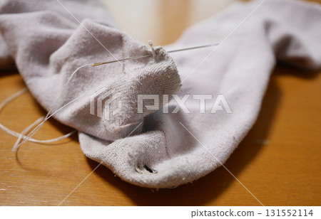 Mending socks 131552114