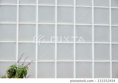 White glass block exterior wall. Square pattern background White glass block exterior wall. Square pattern background 131552934