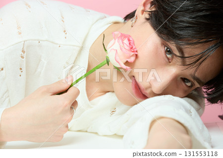 Portrait of a cute young Asian man on pink background Portrait of a cute young Asian man on pink background 131553118