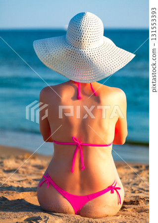 Sexy woman posing on a sea beach 131553393