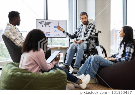 Young diverse professionals collaborating on financial analysis with visible teamwork and inclusion Young diverse professionals collaborating on financial analysis with visible teamwork and inclusion 131553437