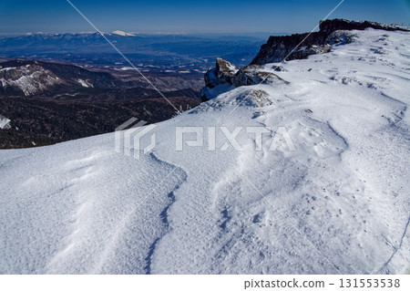 Yatsugatake mountain range in winter, Mt. Asama seen from the summit of Mt. Iodake 131553538
