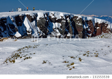Crater wall and climbers of Mount Iodake in the Yatsugatake mountain range in winter Crater wall and climbers of Mount Iodake in the Yatsugatake mountain range in winter 131553539