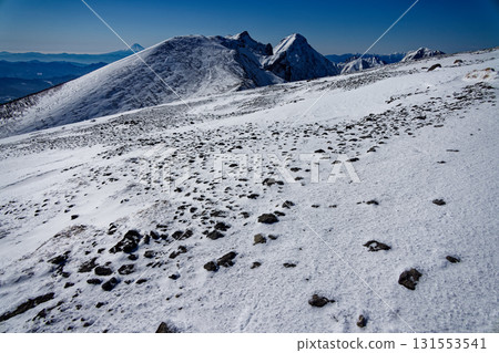 The main peaks of the Yatsugatake Mountains and Mt. Fuji seen from the summit of Mt. Iodake in winter 131553541