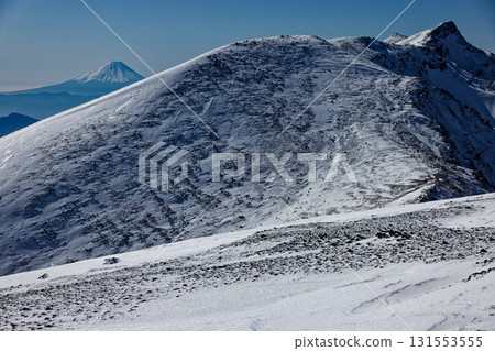 The main peak of Yokodake and Mt. Fuji seen from Mt. Iodake in the Yatsugatake mountain range in winter The main peak of Yokodake and Mt. Fuji seen from Mt. Iodake in the Yatsugatake mountain range in winter 131553555